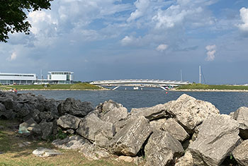 Bridge beyond lagoon of lake